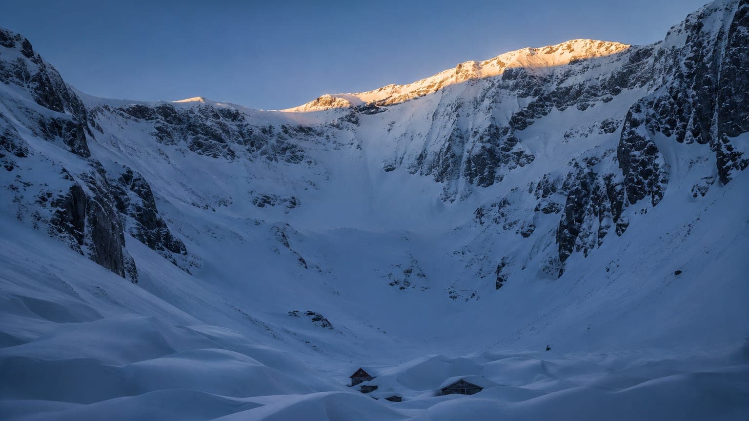 Snow-buried alpine cirque above Alta at dawn