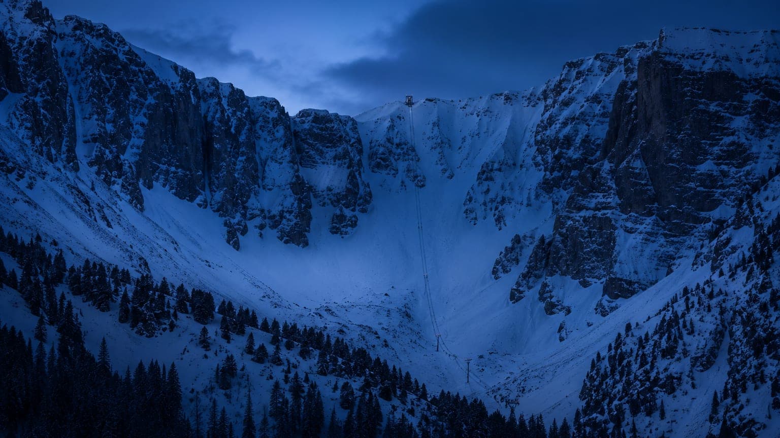 Steep snowy canyon between granite walls at Snowbird